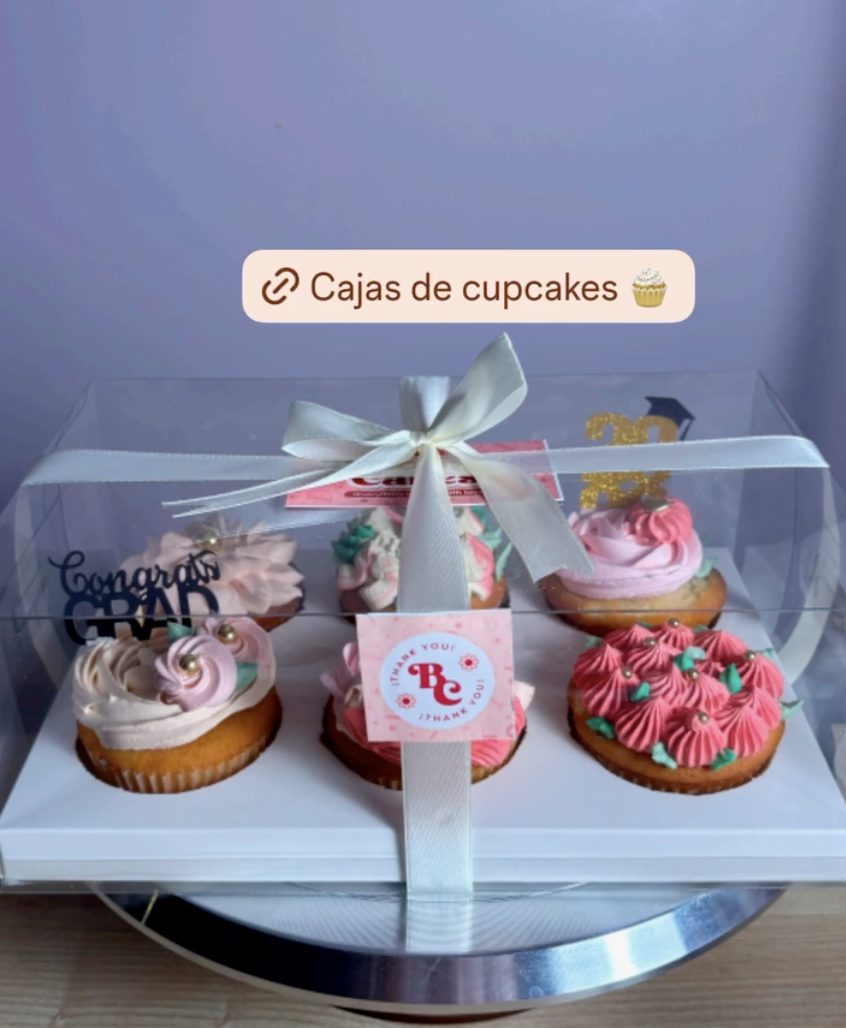 Boxed cupcakes with pink and white frosting