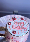 Small birthday cake in a heart-print mug by Bloomey Cakes