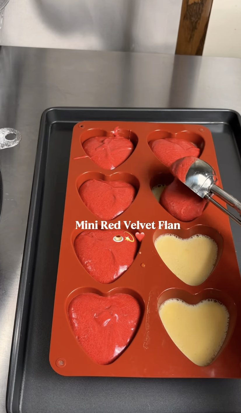 Mini red velvet flan hearts being prepared by Bloomey Cakes
